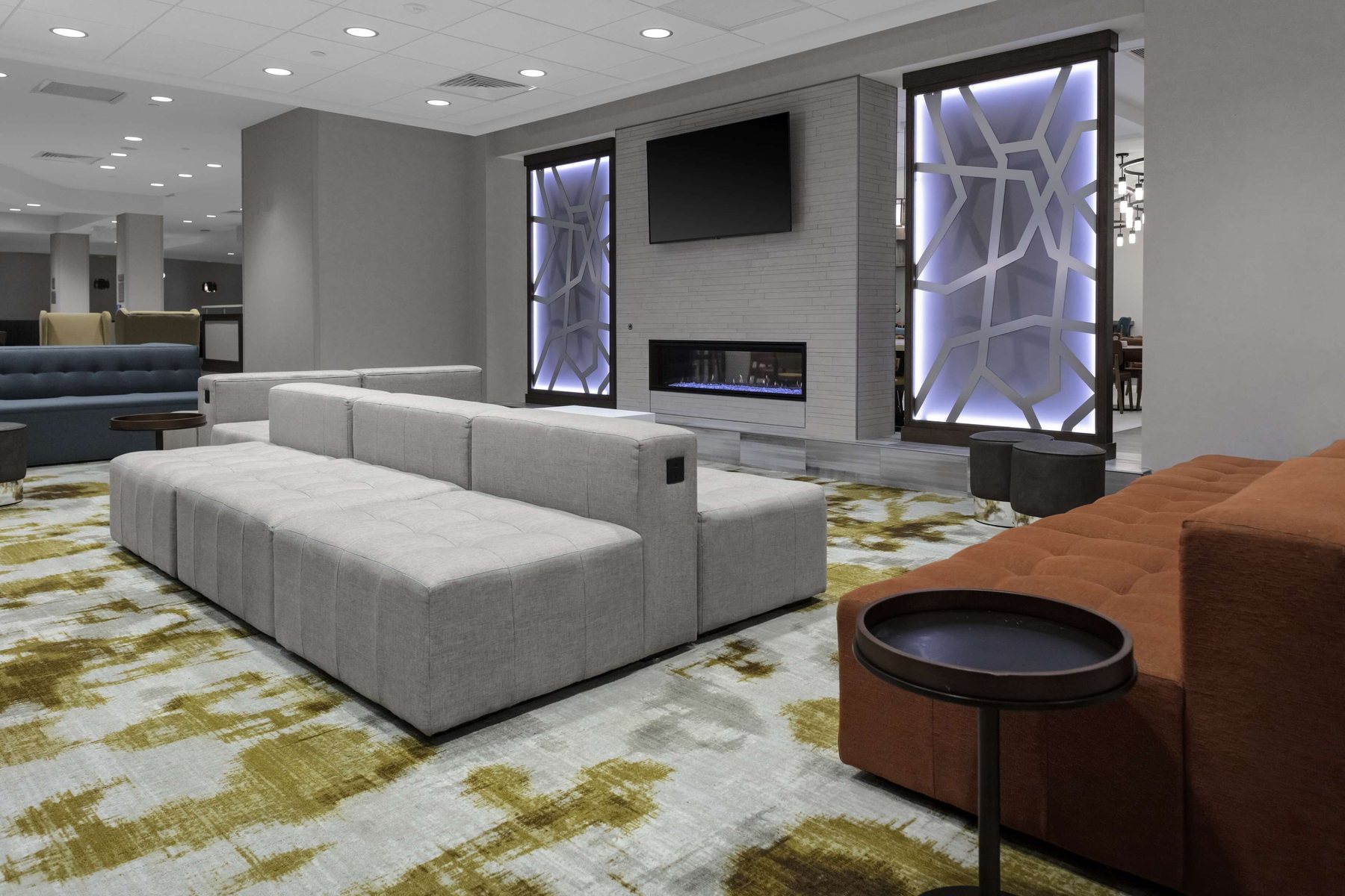 Lobby lounge with fireplace and sectional seating
