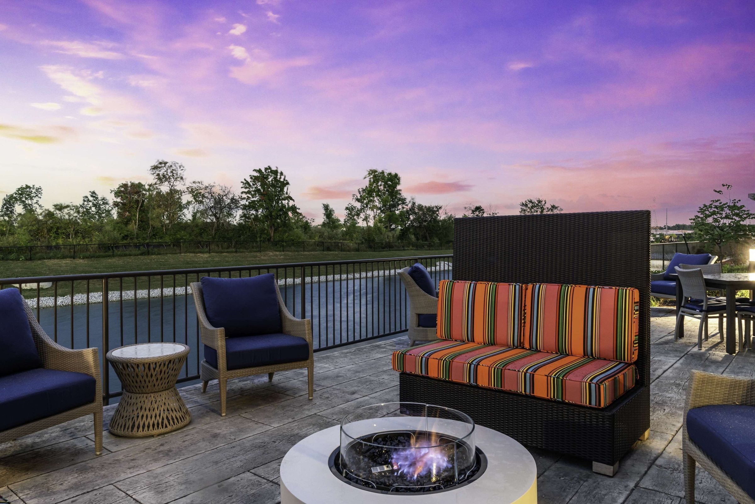 Outdoor terrace with lounge seating at sunset